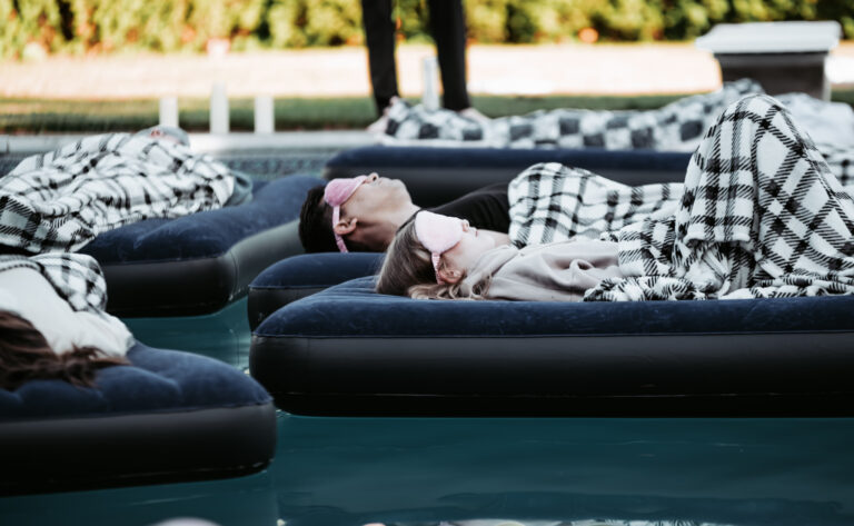 Stillness sound meditation retreat with guests practicing mindful rest on water