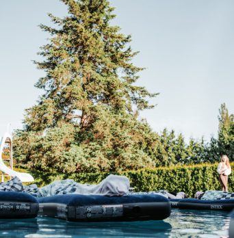 Outdoor floating meditation journey Wellness guests lying peacefully during an outdoor floating meditation journey